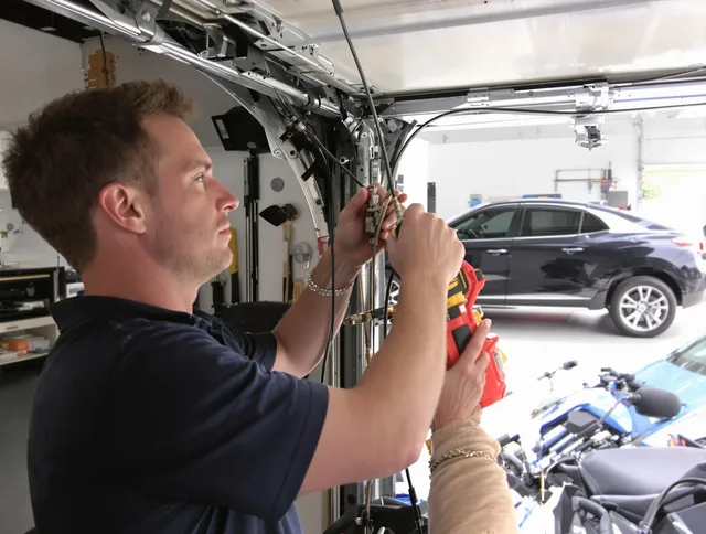 Fairfield Garage Door Repair safety certified technician performing cable replacement in Fairfield